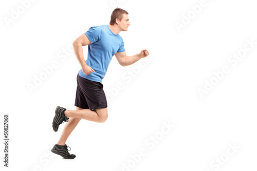 Full length portrait of a male athlete running