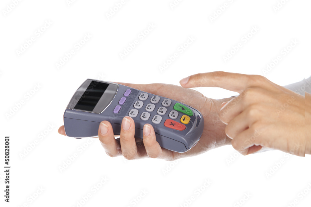 Hand and fingers entering pin with a hand held pin pad. Hand and fingers entering pin with a hand held pin pad.