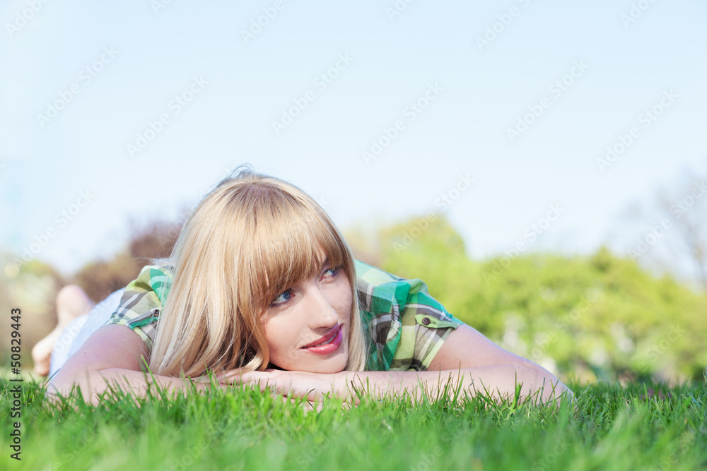 woman laying on grass woman laying on grass