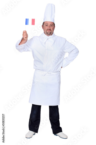 chef holding French flag isolated on white