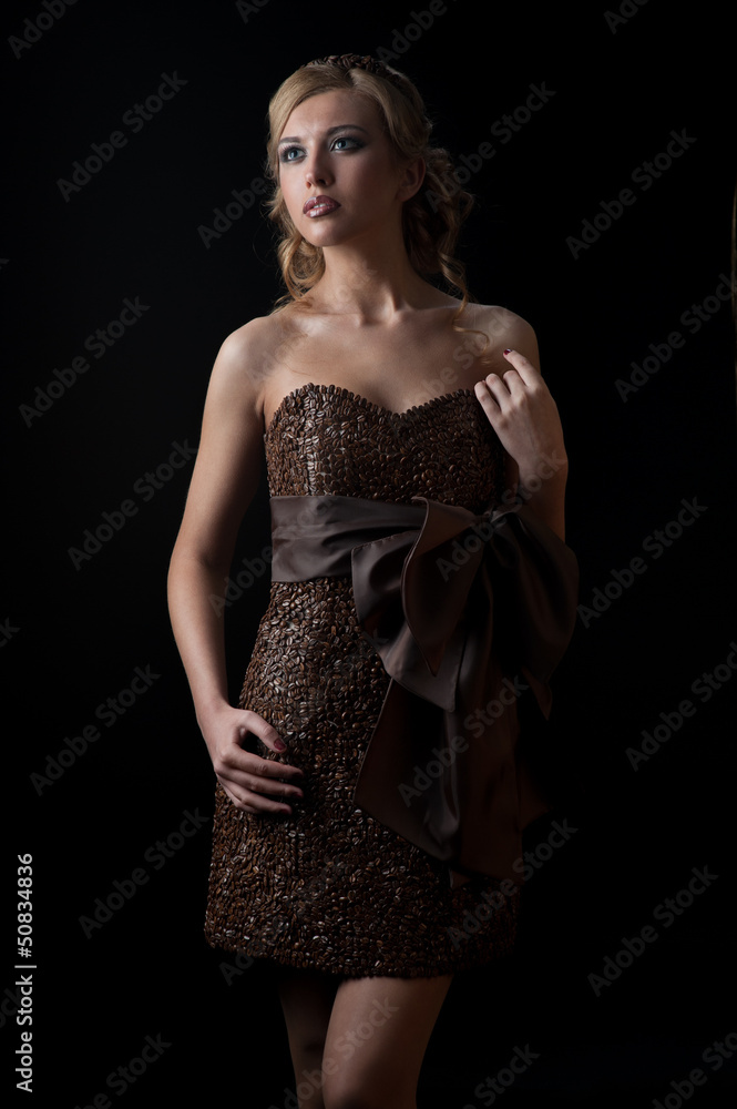 girl in dress made of coffee beans