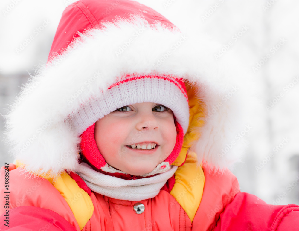 Beautiful happy kid in the red warm clothing Beautiful happy kid in the red warm clothing