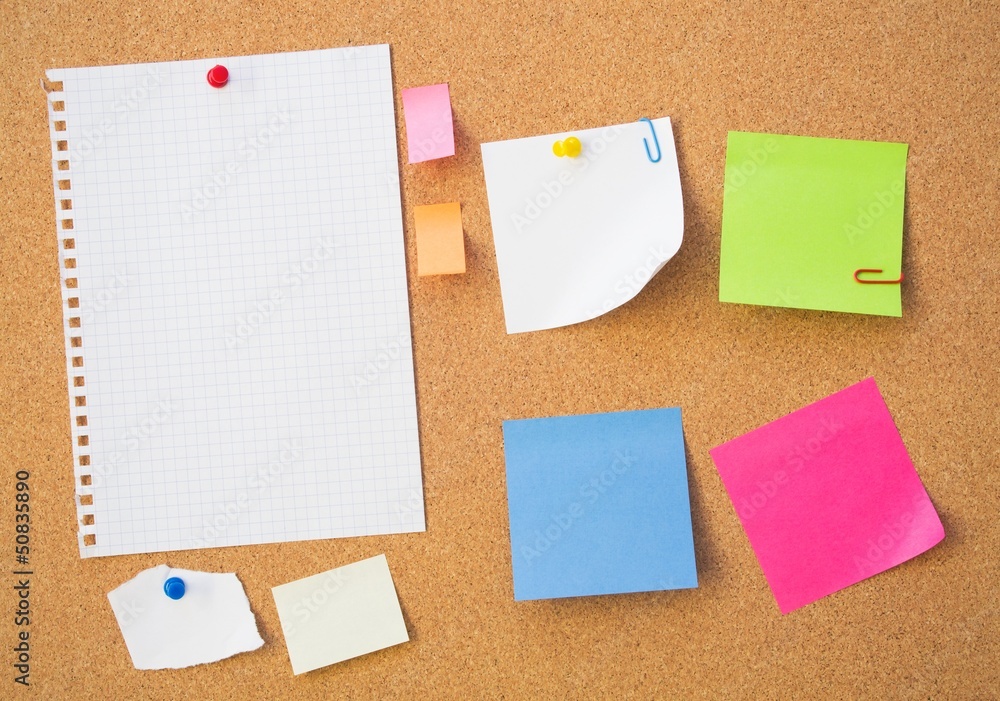 Colour note papers on pin board. Cork background Colour note papers on pin board. Cork background