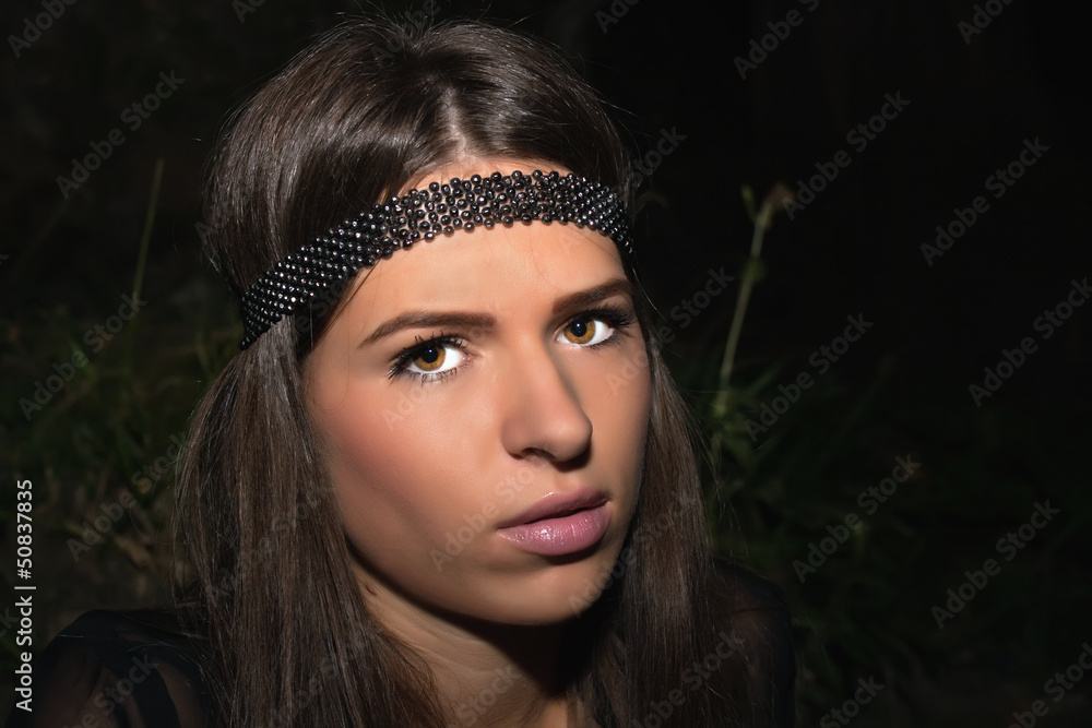 Beautiful brunette with a black headband Beautiful brunette with a black headband