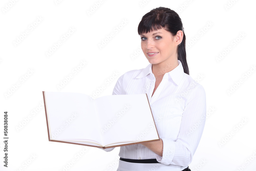 a waitress presenting a visitors book a waitress presenting a visitors book