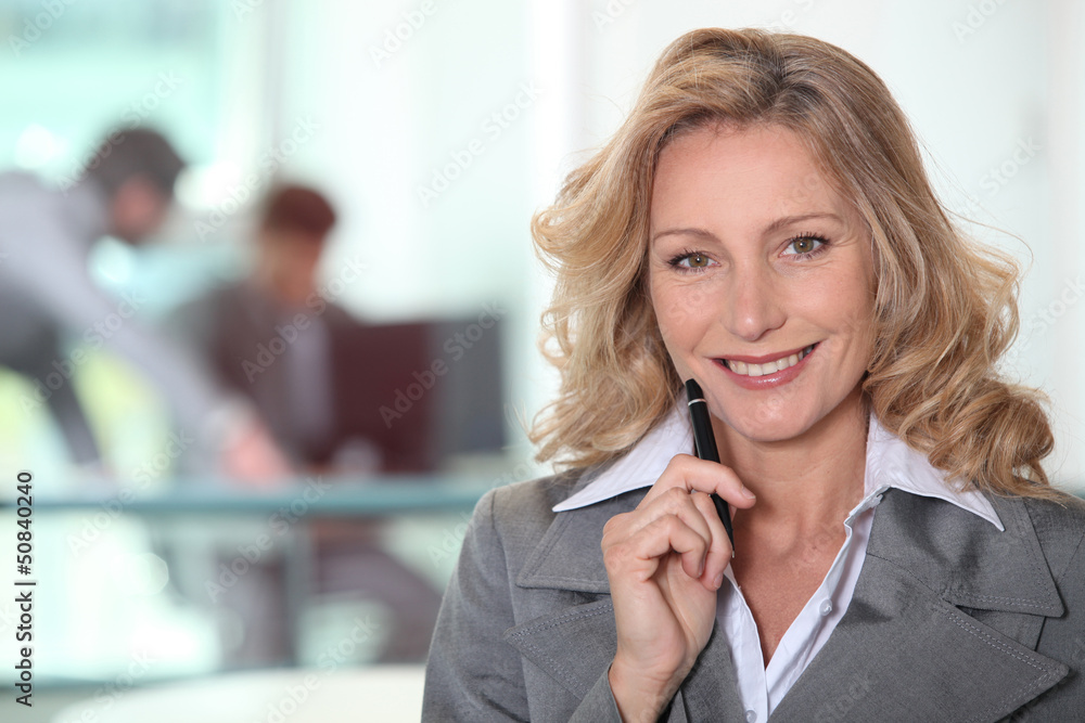 Portrait of mature woman in gray suit Portrait of mature woman in gray suit