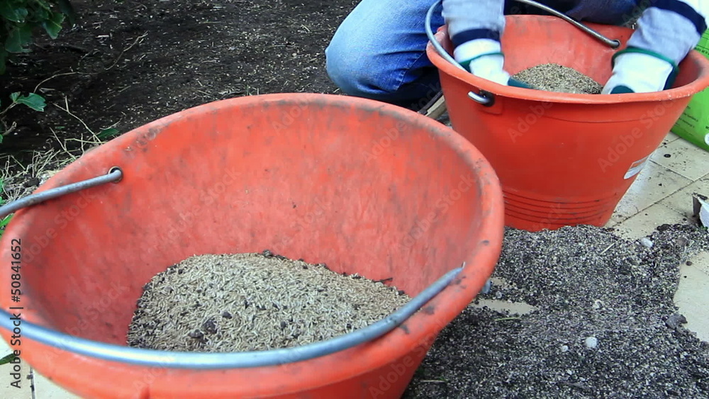Man prepares seed and fertilizer for sowing Man prepares seed and fertilizer for sowing