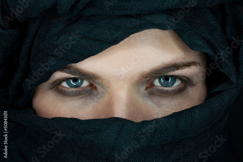 eyes of a beautiful man with black scarf photo