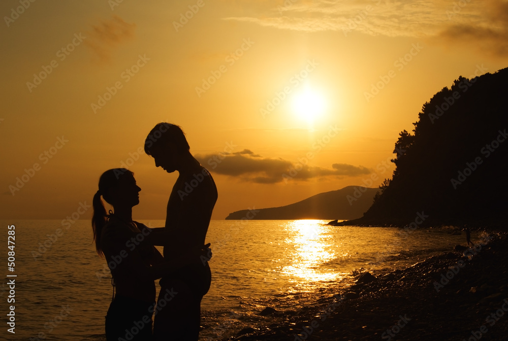 silhouette of couple in love at sunset