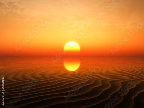Sunset showing behind sand ripples