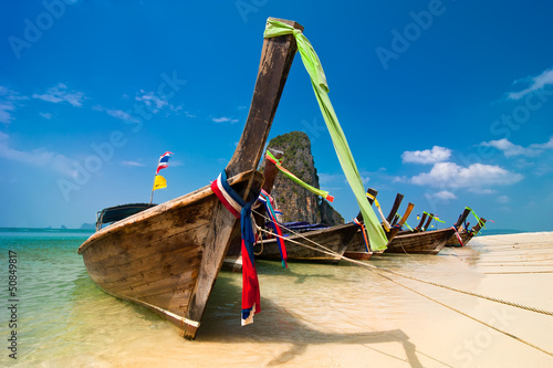 Tropical beach landscape. Thai traditional long tail boats