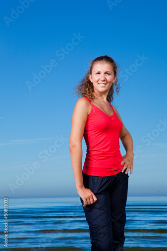 Cute sport girl at the beach