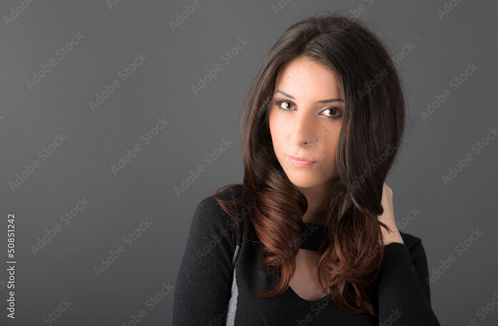 young woman posing on gray background in studio young woman posing on gray background in studio