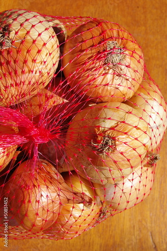 White onions in red net