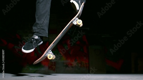 Skater doing ollie trick on concrete