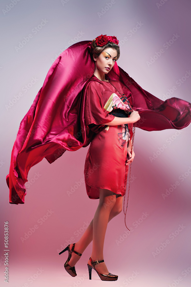 Fashion asian woman wearing traditional japanese red kimono Fashion asian woman wearing traditional japanese red kimono