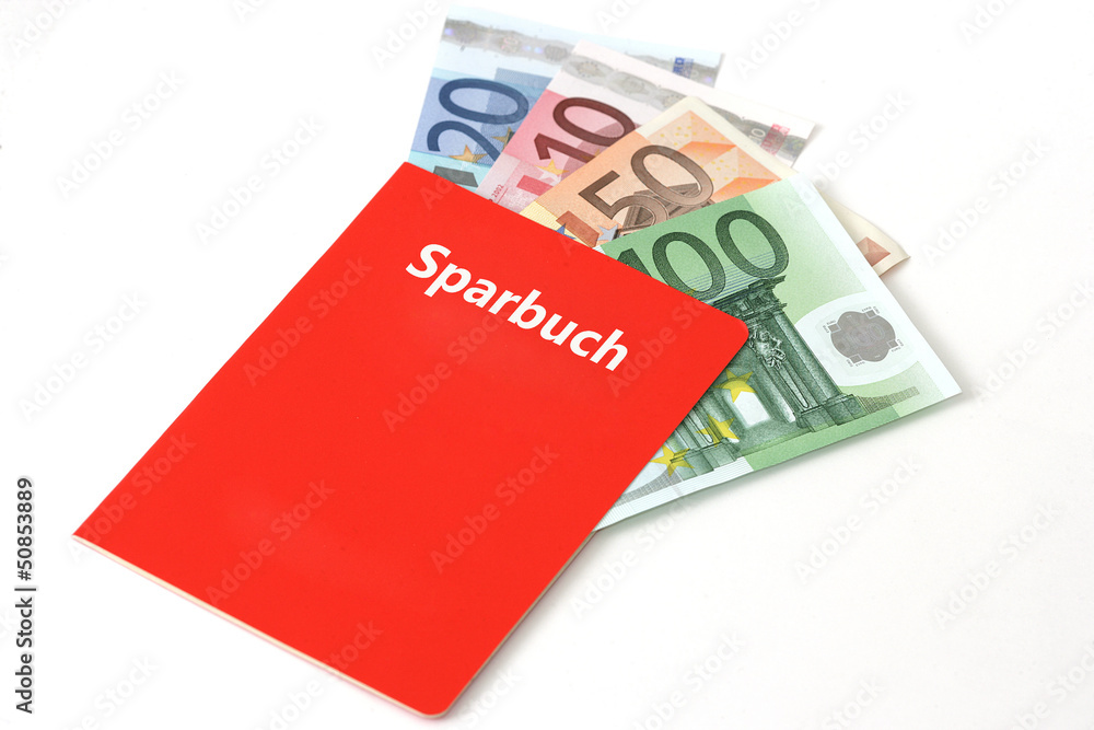 Rotes Sparkassenbuch, in dem sich Geldscheine befinden Rotes Sparkassenbuch, in dem sich Geldscheine befinden