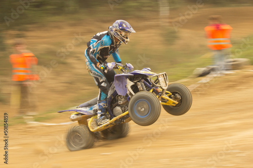 Dynamic shot of rider in the quad jump