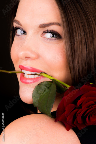 You beautiful female with a rose in her mouth