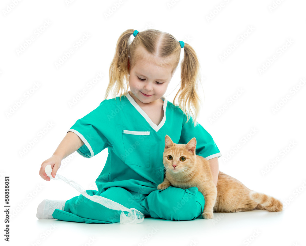 Cute kid playing doctor with cat isolated Cute kid playing doctor with cat isolated