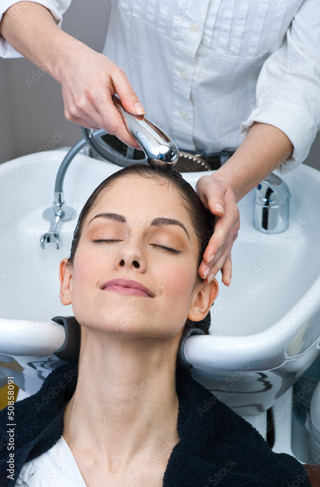 attractive woman washing her hair attractive woman washing her hair