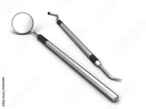 Dental mirror and dental pick on a white background.