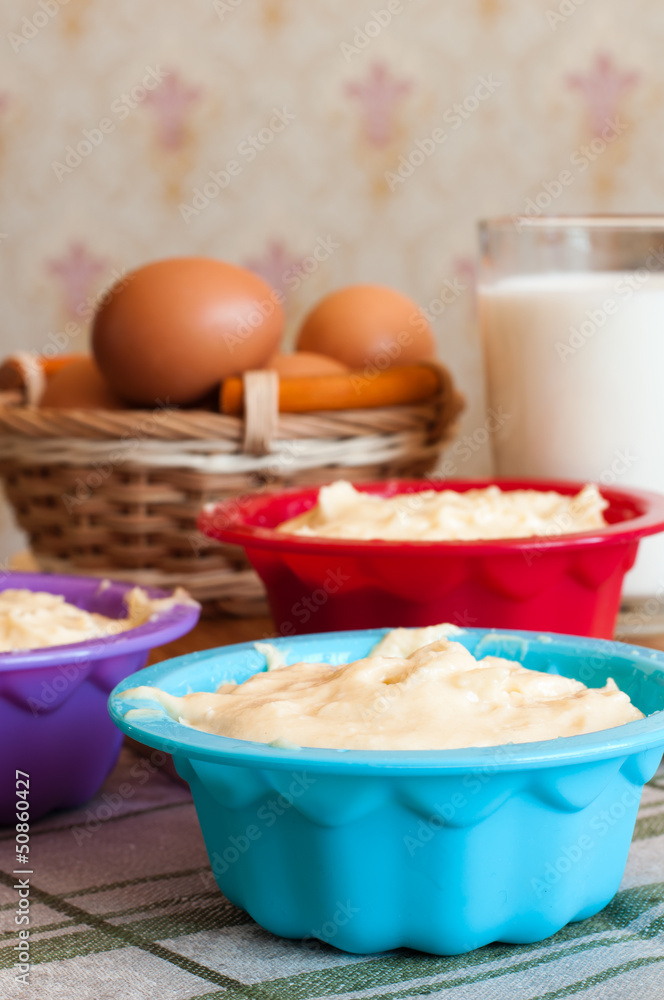 Dough for cakes in tins for baking Dough for cakes in tins for baking
