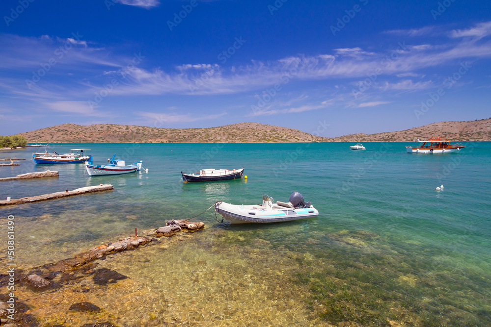 White Greek boats at the coast of Crete