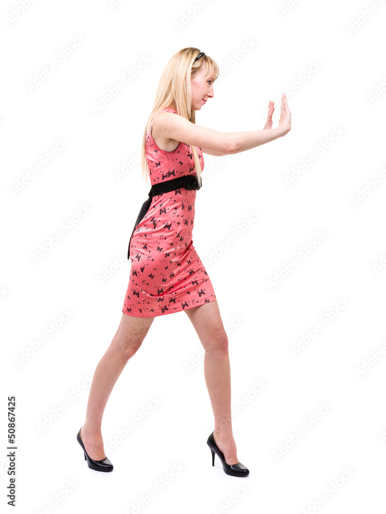 Woman pushing something imaginary Woman pushing something imaginary