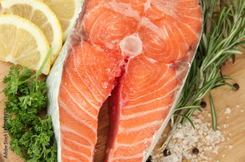 Fresh salmon steak on cutting board,close up