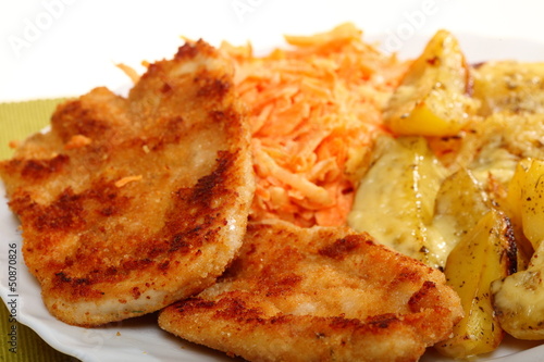 Fried chicken roasted potatos and carrot salad