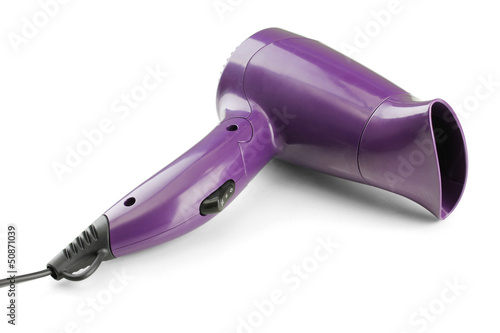 Hair dryer on purple background