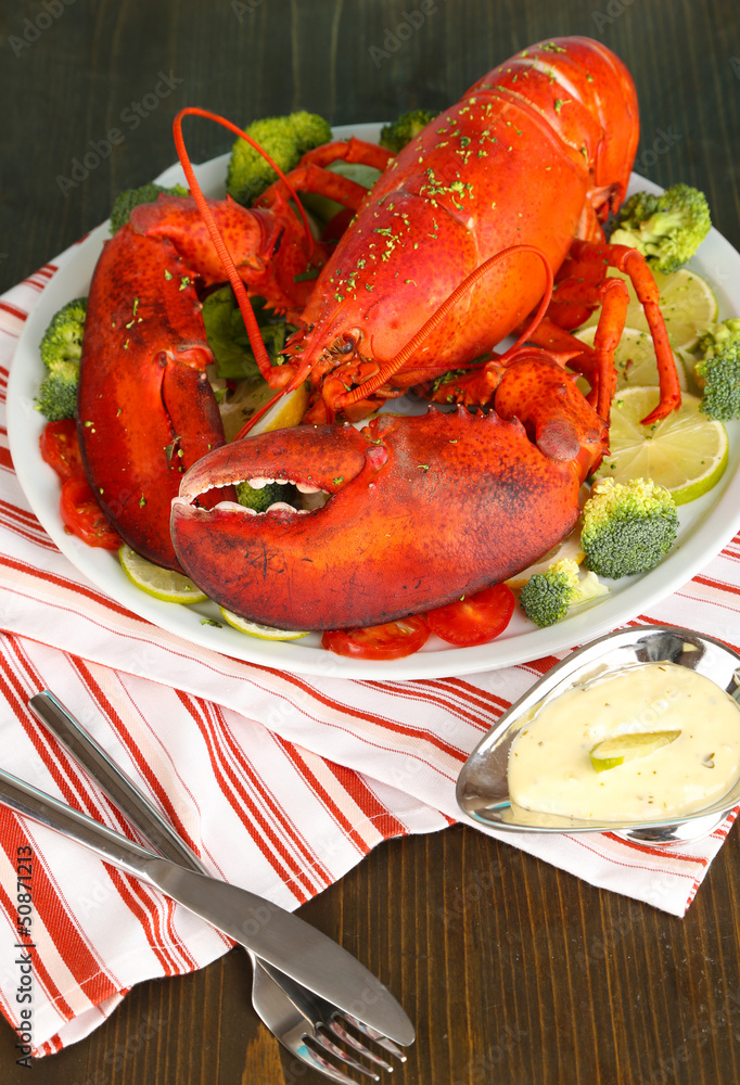 Red lobster on platter on table close-up Red lobster on platter on table close-up