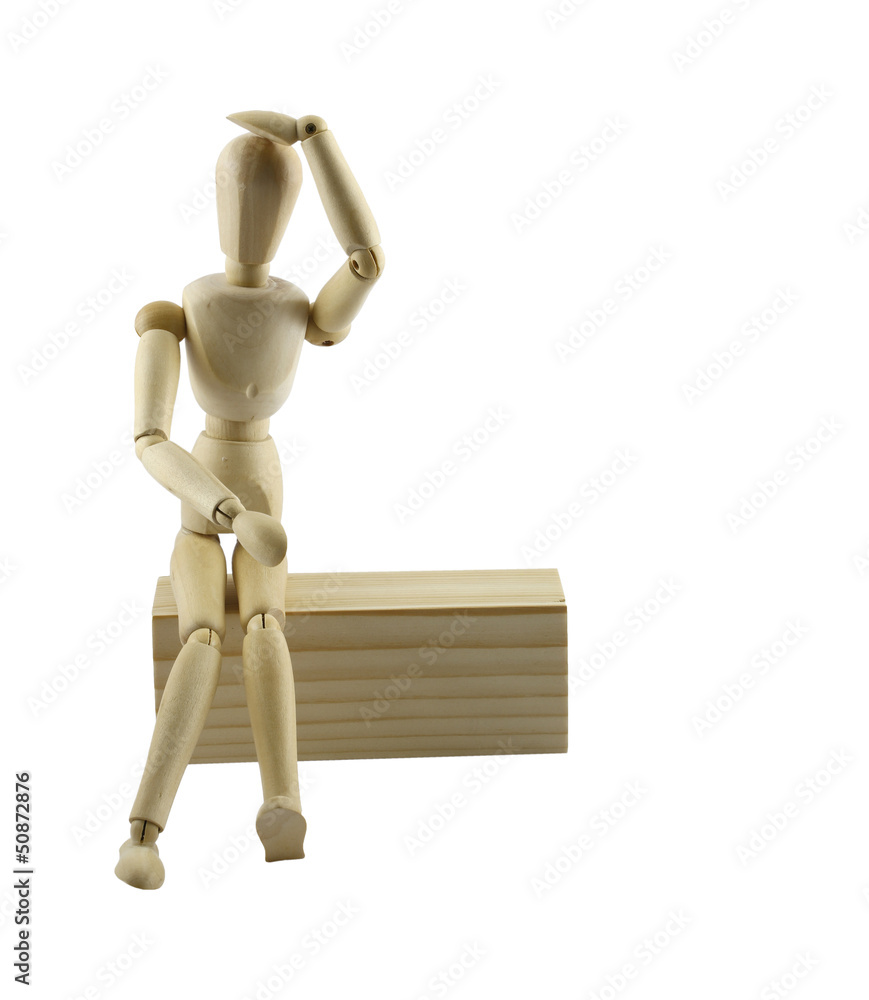 Wooden puppets sit on box with clipping path Wooden puppets sit on box with clipping path