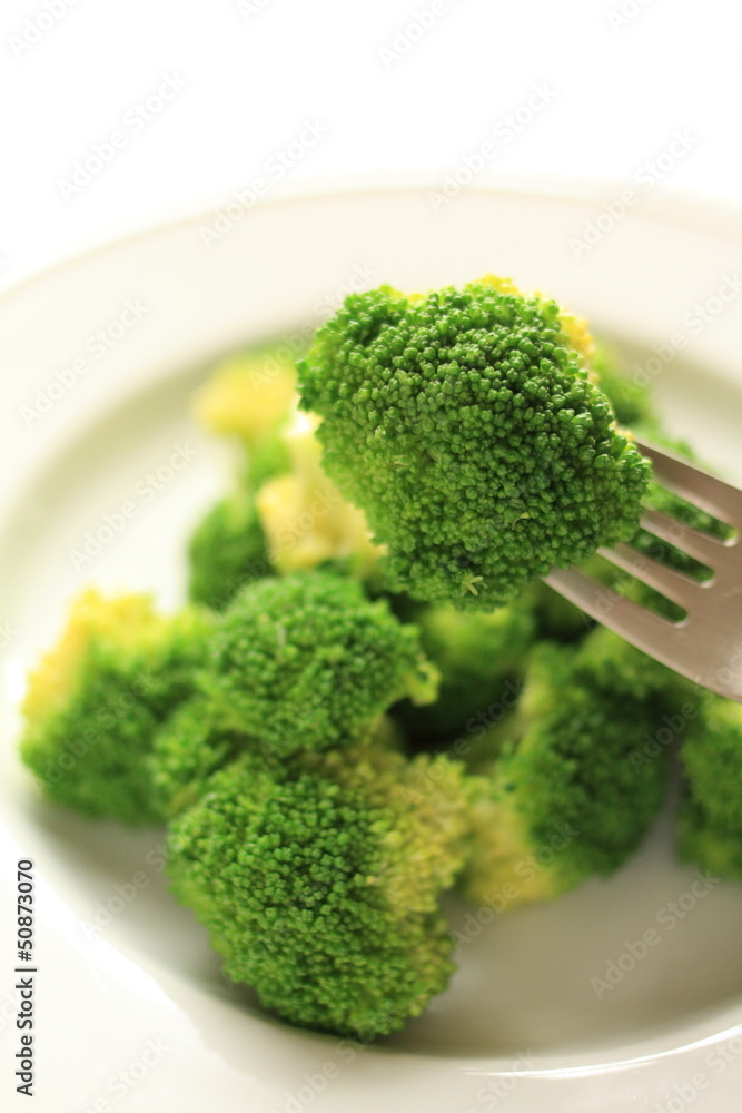 steamed broccoli on white dish with copy space steamed broccoli on white dish with copy space