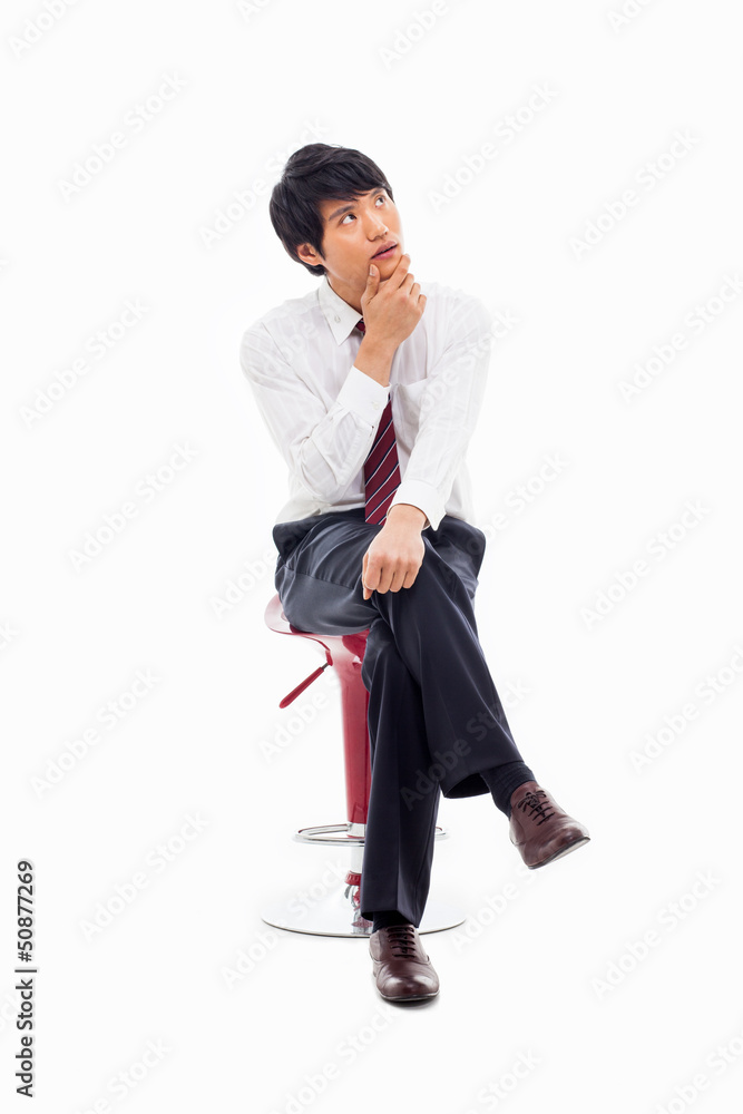Young Asian business man sitting on the chair Young Asian business man sitting on the chair