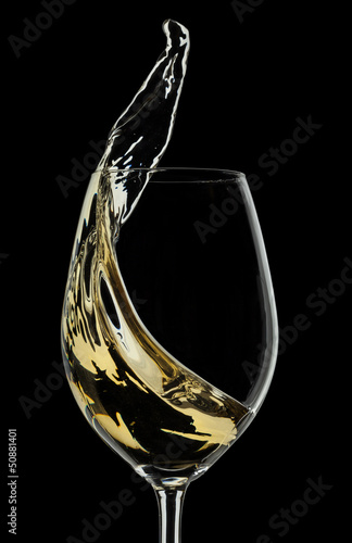 White wine splash on black background