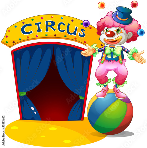 A clown at the top of a stripe ball