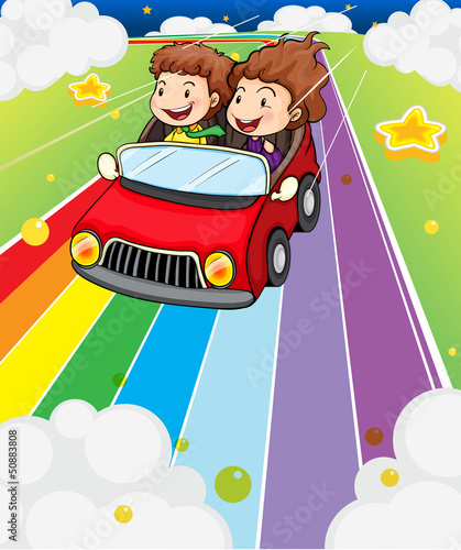 Two kids riding in a red car