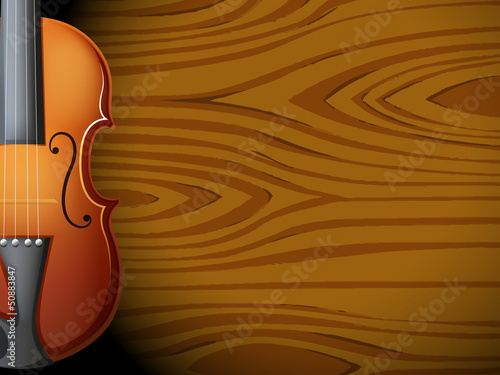 A guitar in front of a wooden wall