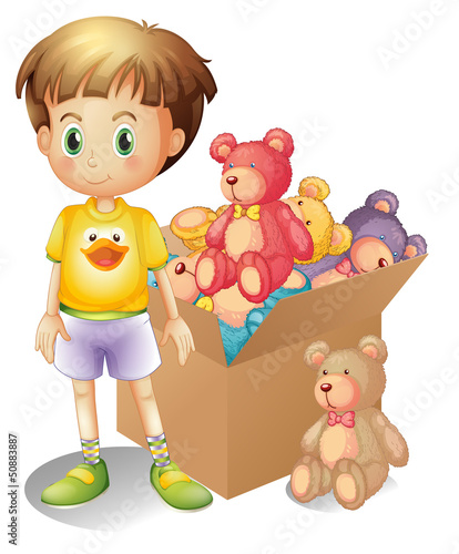 A boy beside a box of toys