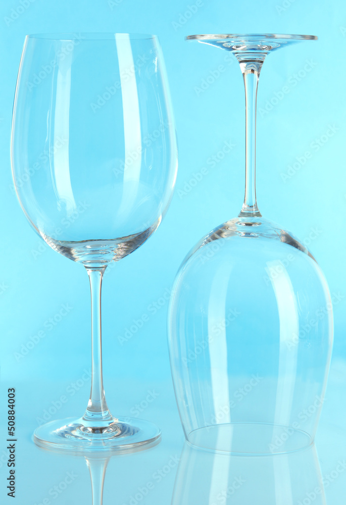 Two glasses on light blue background Two glasses on light blue background