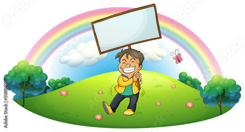 A happy boy holding an empty signboard