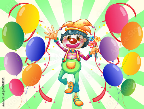 A female clown in the middle of the balloons