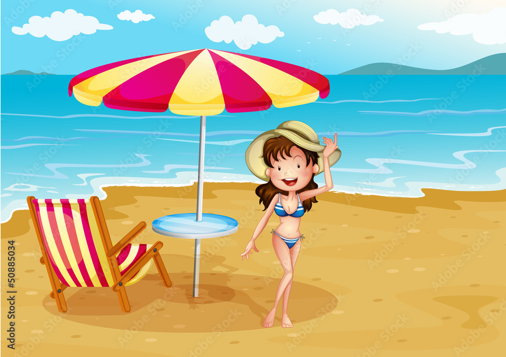 A woman wearing a stripe swimsuit at the beach A woman wearing a stripe swimsuit at the beach