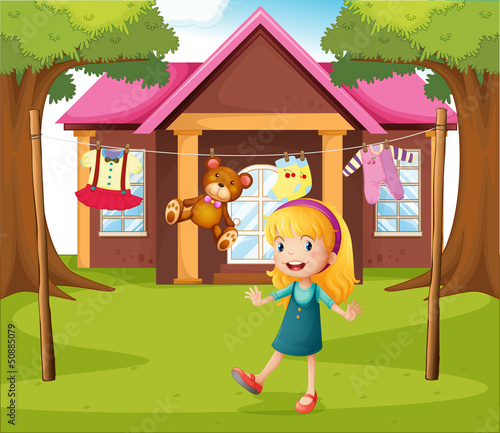 A girl in front of their house