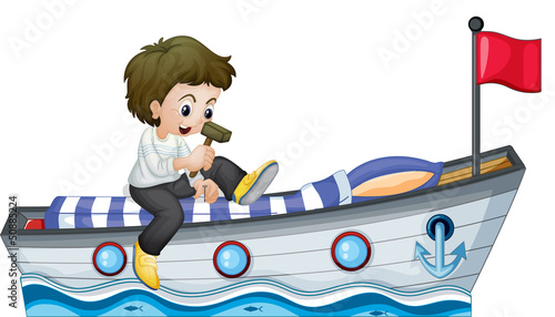 A boy riding in a boat with a red flag