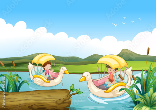 Two swan boats at the river