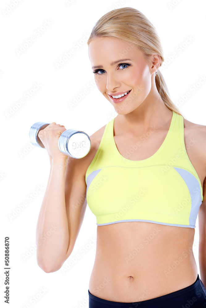 Close up of blond happy woman with dumbbell Close up of blond happy woman with dumbbell