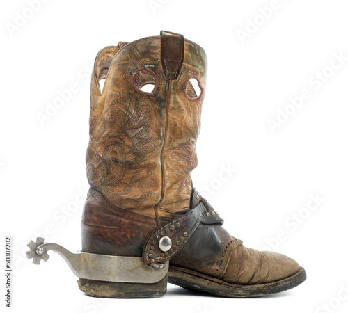 Side view of a Cowboy boot with spur, isolated on white